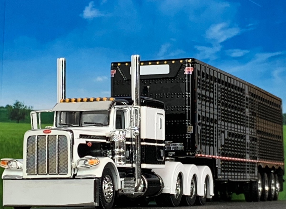 1/64 DCP PETERBILT 389 TRI AXLE W/ 70