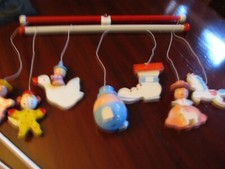 Vintage wooden Mother Goose musical mobile. 7 hanging characters.