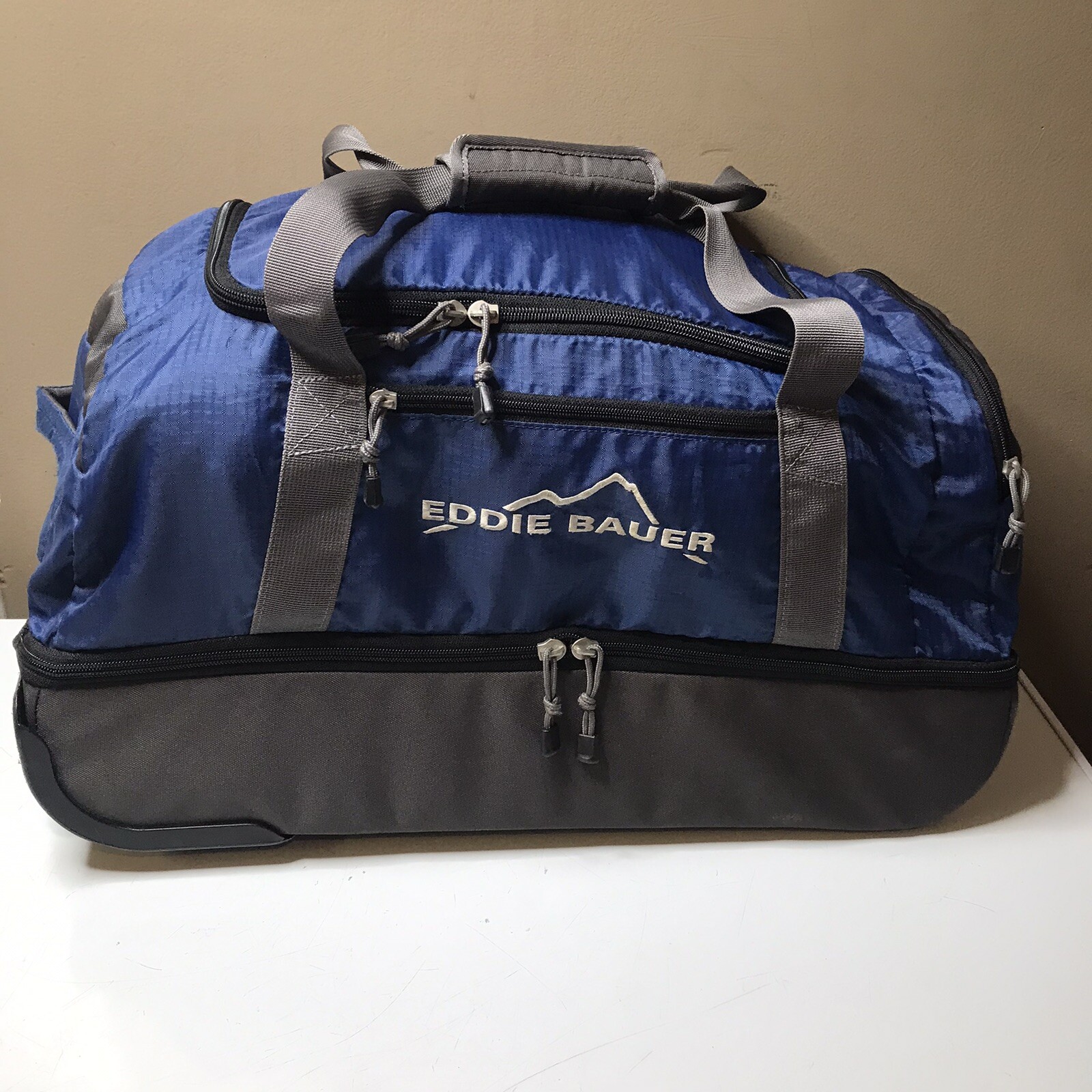 EDDIE BAUER Rolling Duffel Travel Bag Blue w Handle Water Resistant