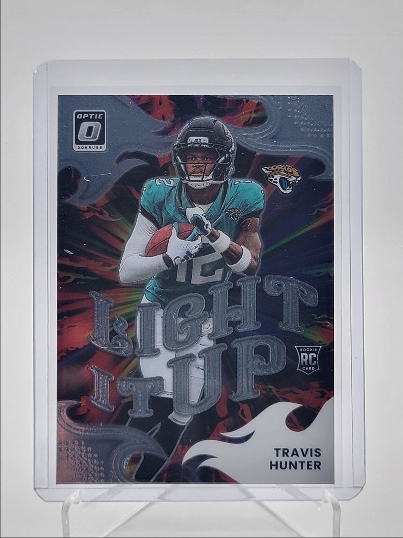 TRAVIS HUNTER 2025 DONRUSS OPTIC LIGHT IT UP ROOKIE JAGUARS RC Q6118