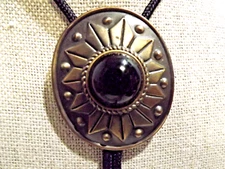 Bolo Tie Bronze Medalion Black Round Stone and Bronze Tips Black Rope 2.75x2.25