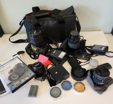 HUGE Nikon D90 12.3MP Digital DSLR Camera Bundle With 5 lenses 4 cards 2 flash
