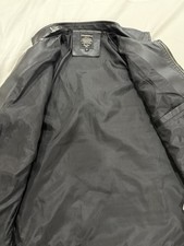 Men's black leather jacket, used and with defects on the sleeve and collar