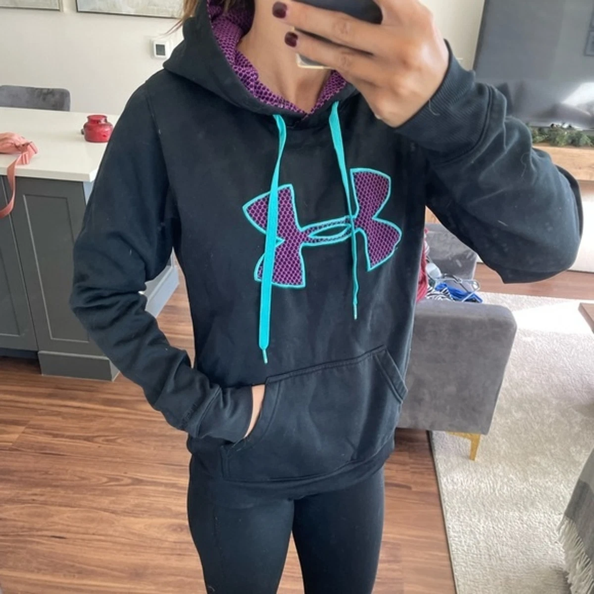 Black under armor hoodie. Black teal and purple . Women’s size small.