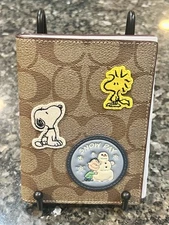 NWT Coach X Peanuts Passport Case Signature Canvas w/ Patches, Snoopy, Woodstock