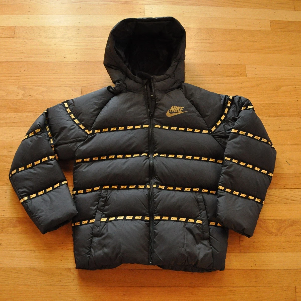 Nike jacket sales black and gold