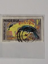 1965 Nigerian postage stamp featuring a Blue-Breasted Kingfisher, designed by...
