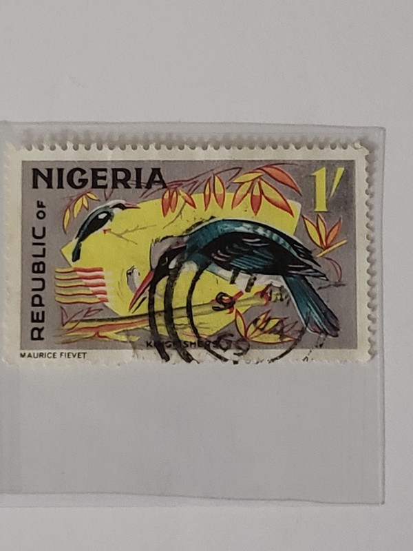 1965 Nigerian postage stamp featuring a Blue-Breasted Kingfisher, designed by...