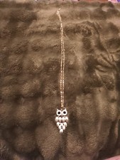 Gold tone owl pendant on chain necklace,multi color stones.