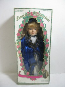 limited collection genuine porcelain doll and matching miniature ornament