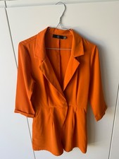 Smart and stylish orange playsuit by Misguided. Size 10. 