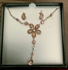Pretty Flower Shaped Necklace In Pink Coloured Gems On A Silver Toned Setting.