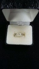 STERLING SILVER SIZE 6.25 RING WITH DESIGN CONTINUOUS AROUND BAND 1.8 GRAMS