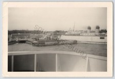 1940-50s Black And White Photo Of A Small Cruise Ship Coming Into Port