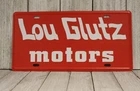 Lou Glutz Motors License Plate Tin Sign Vacation Movie Prop Chevy Chase