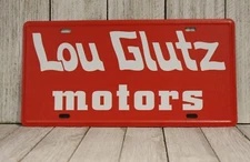 Lou Glutz Motors License Plate Tin Sign Vacation Movie Prop Chevy Chase 