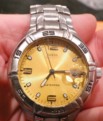 guess watch, rare yellow dial, keeps good time, date, steel band