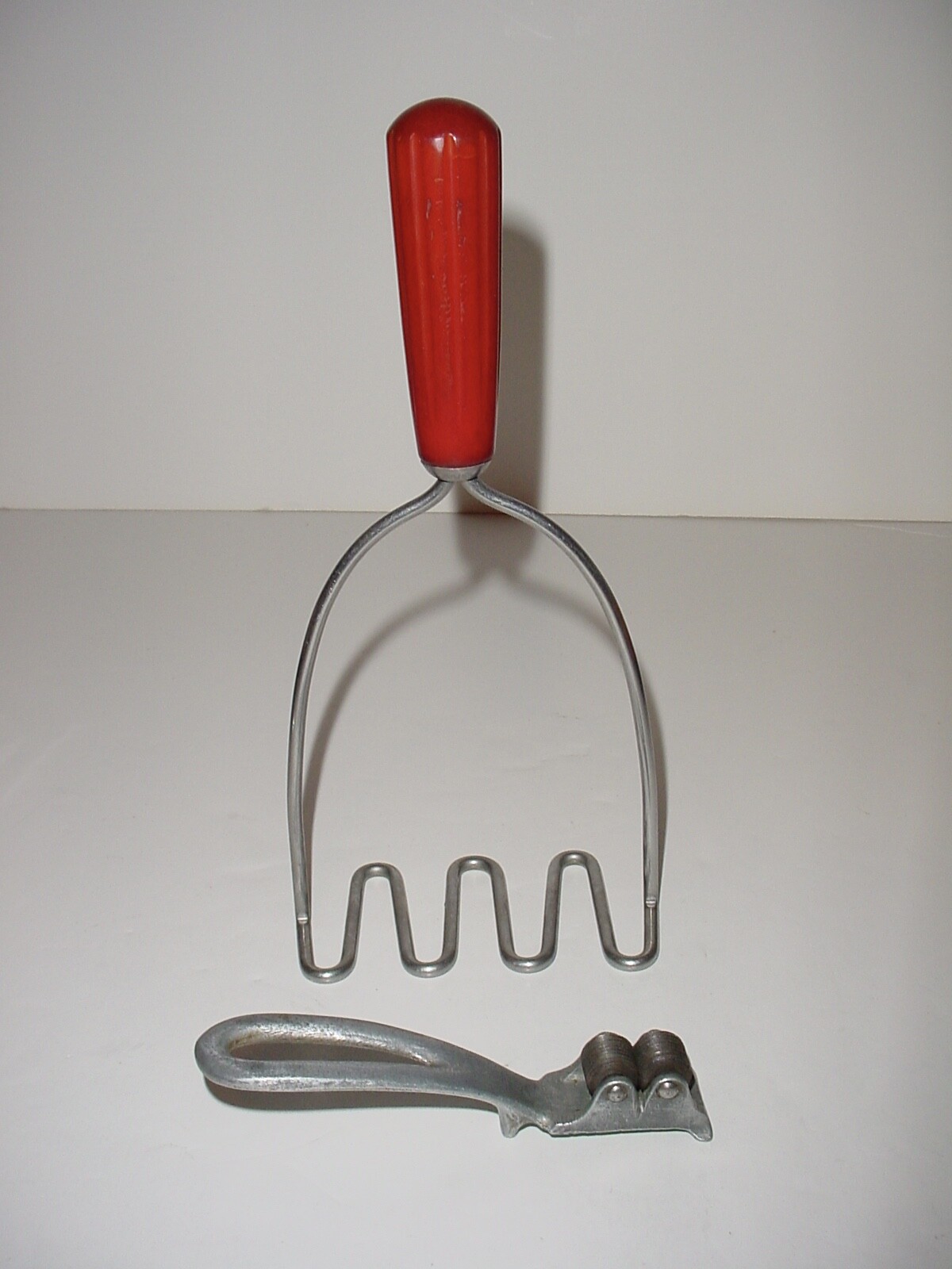 Vintage Stainless Potato Masher Red Bakelite Handle and Knife Sharpener