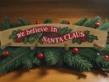 Hand-painted We believe in Santa Claus stocking hanger designed by Langolier