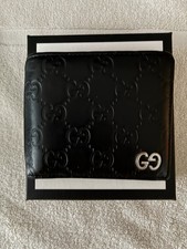 Gucci Black GG Embossed Leather Bi Fold Wallet