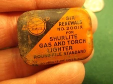 RARE OLD VTG ANTIQUE ORANGE TIN - "RENEWALS FOR SHURLITE GAS AND TORCH LIGHTER"