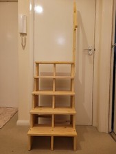 step stool with handle and two castors. 
