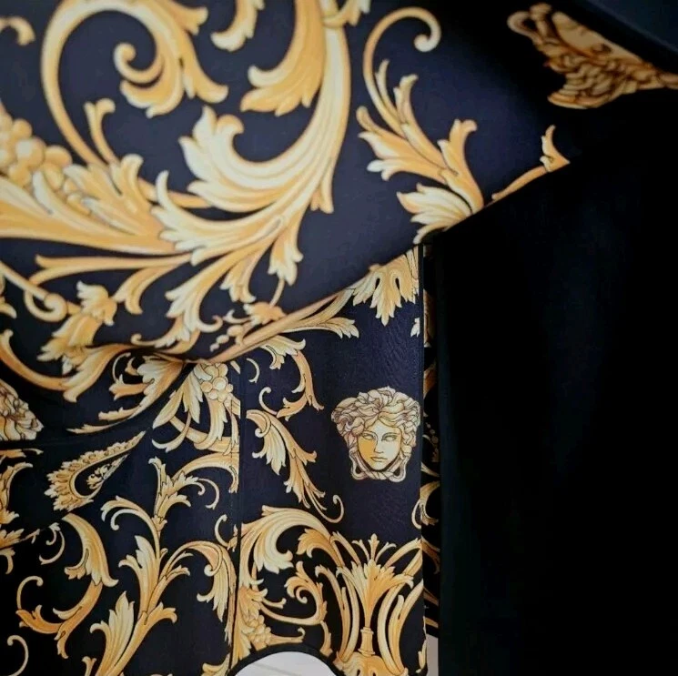 Abito smanicato nero VERSACE con bottoni Medusa oro taglia SMALL