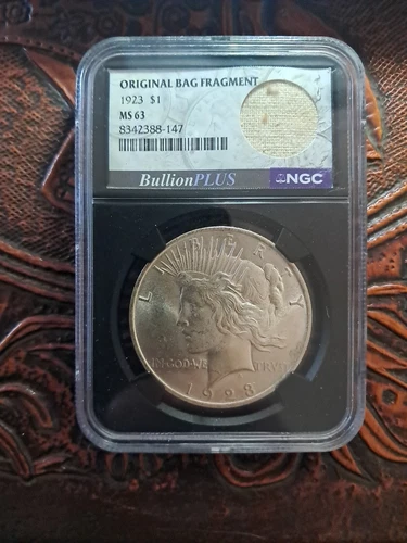 1923 P Peace Silver Dollar NGC MS-63 Original Bag Fragment