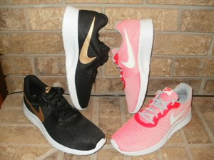 nike tanjun mens black and gold