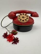 VINTAGE METAL TOY PHONE WITHMOVEABLE DIAL FROM THE 1940'S RED, GREEN AND TAN