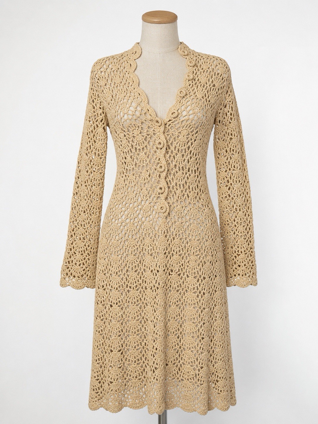 Cream open-knit crochet dress with a high neck and button front