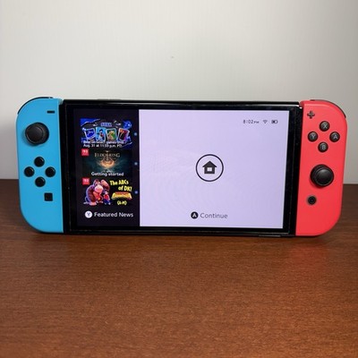 Nintendo Switch   OLED Model w/ Neon Red & Neon Blue Joy-Con