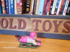 NICE VINTAGE WIND UP CELLULOID BOY ON A SLED made in OCCUPIED JAPAN