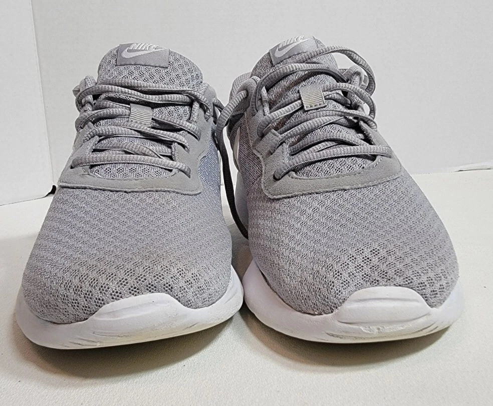 Nike grey tanjun best sale sneakers