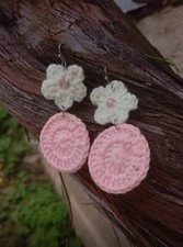Crochet earrings with white, yellow, and light pink daisies