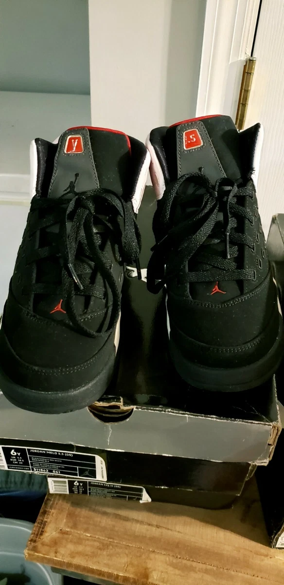 black and gold jordan 11s