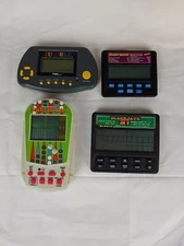 Lot of 4 Electronic Handheld Games Slots All in Good Working Condition