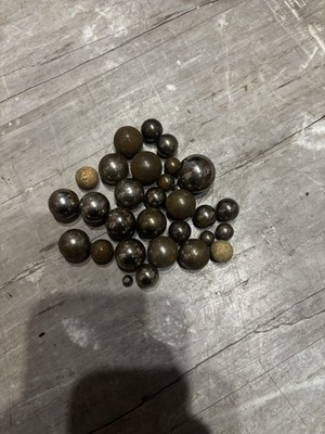 These are vintage steel marbles, also known as ''steelies'' or ball bearings