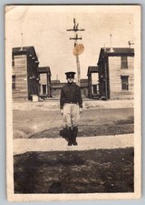 Vtg B W Snapshot Army Soldier In Uniform Standing By Military Barracks 1920s