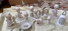 A Mixed Lot of 11 Precious Moments Figurines  Others.