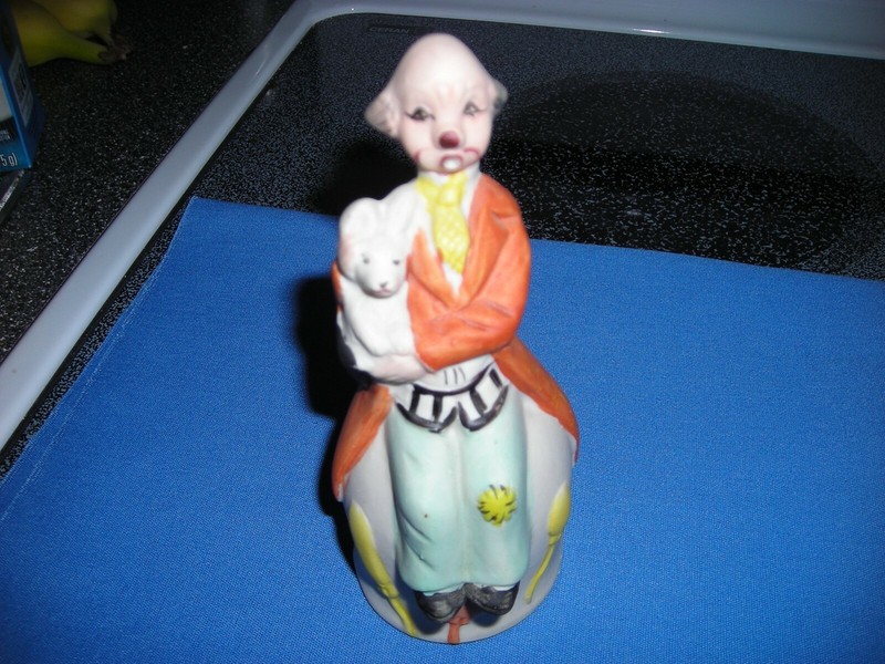 Circus Clown Holding His Dog sitting on a bell - ceramic