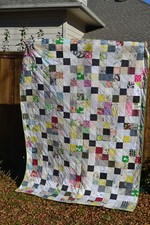 Modern patchwork quilt; lots of quality designer fabric