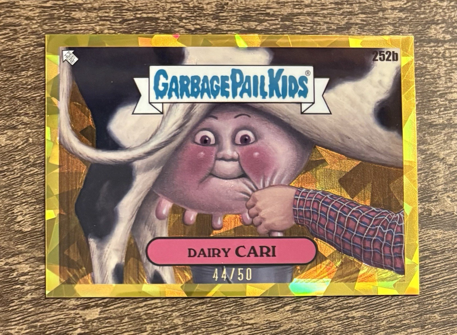 2024 Topps Garbage Pail Kids Chrome Gold Sapphire #252b Dairy Cari front