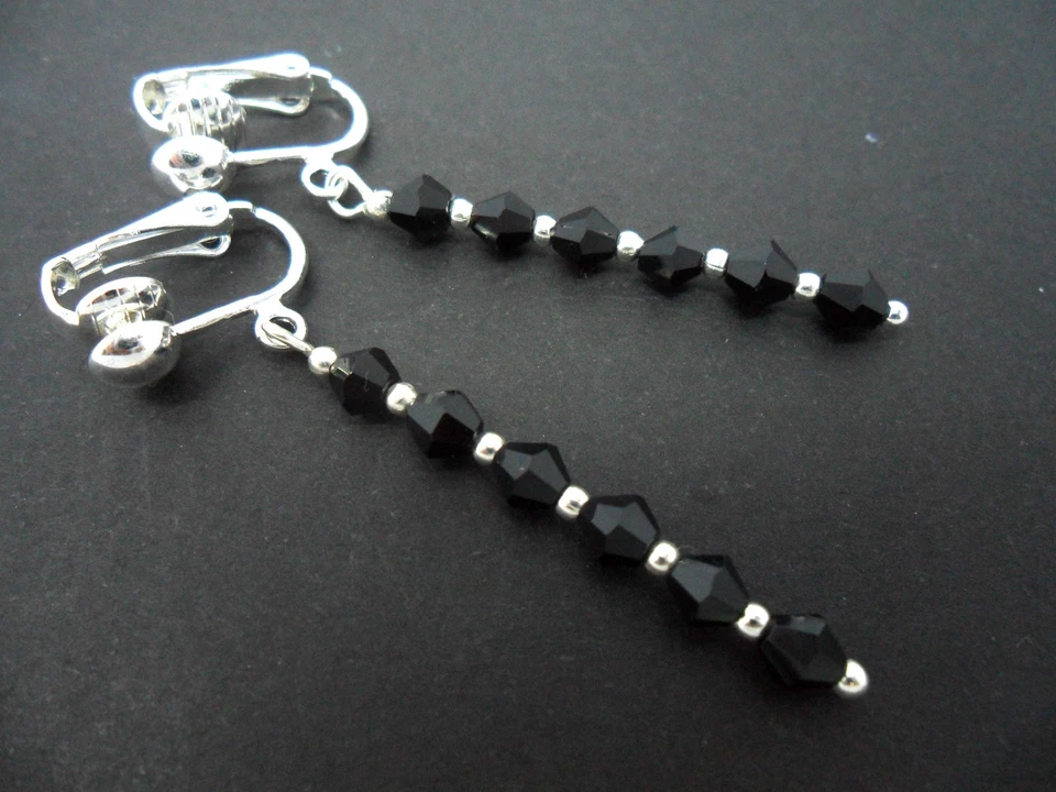 A PAIR OF BLACK CRYSTAL GLASS BEAD SILVER PLATED CLIP ON DROP EARRINGS. NEW. - Image 1 of 1