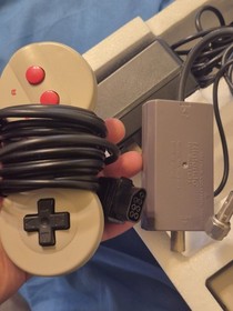 Classic NES game console. 2 controllers and NES advantage in box with packaging