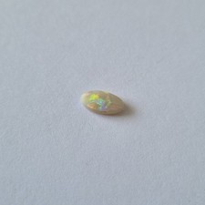 Australian Coober Pedy Crystal Opal 0.5ct Oval Cabochon Rainbow Fire