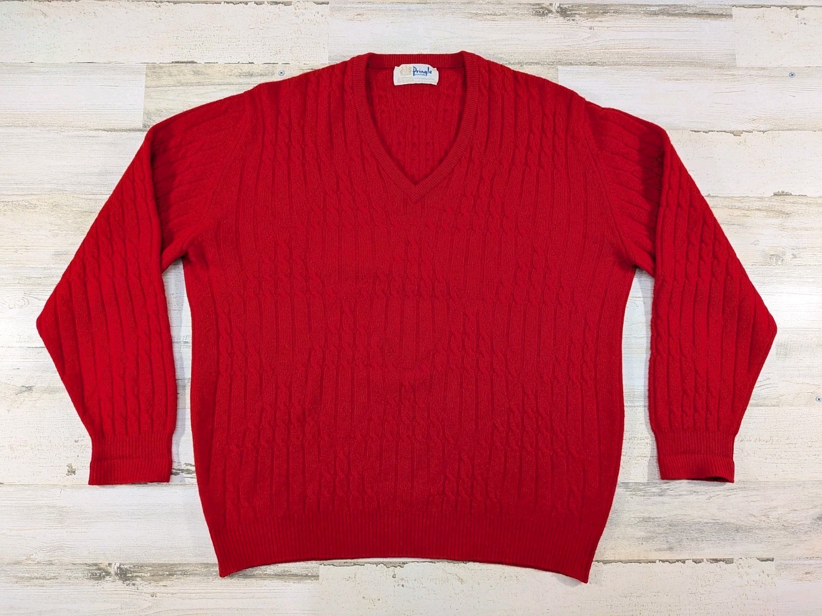 Red cable-knit V-neck lambswool sweater with Pringle label