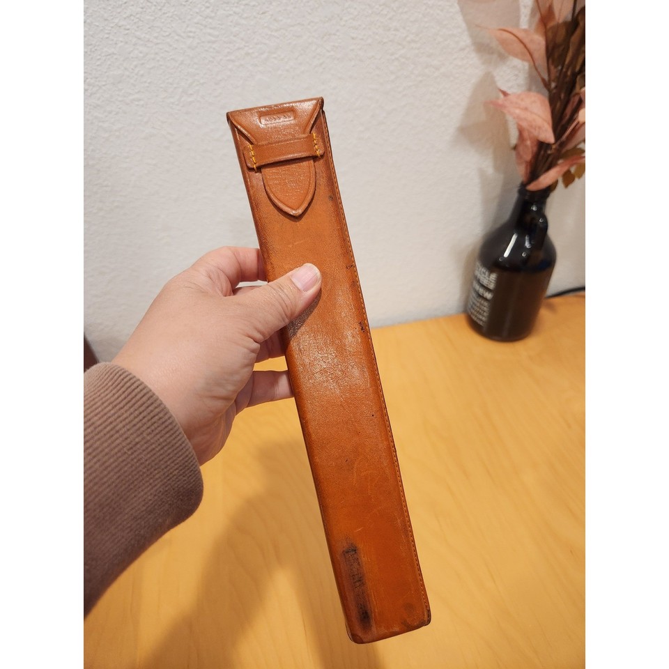 A genuine pre-digital computing artifact — this K&E Polyphase slide rule with its original leather case is a tactile piece of American engineering history from the patent-era 1900s.