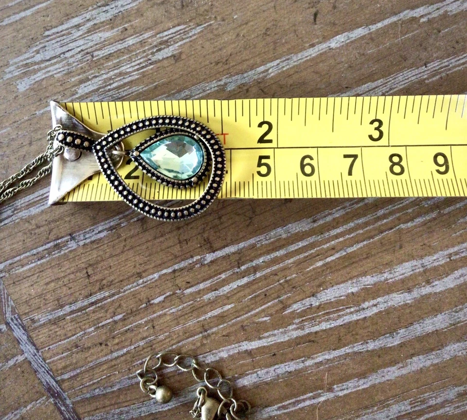 Conjunto de collar y pendientes Avon topacio tono lágrima azul y dorado Avon Foto 4 de 4