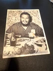 Fidel Castro 60s photo eating with chopsticks and drinking Coke.  On card stock.